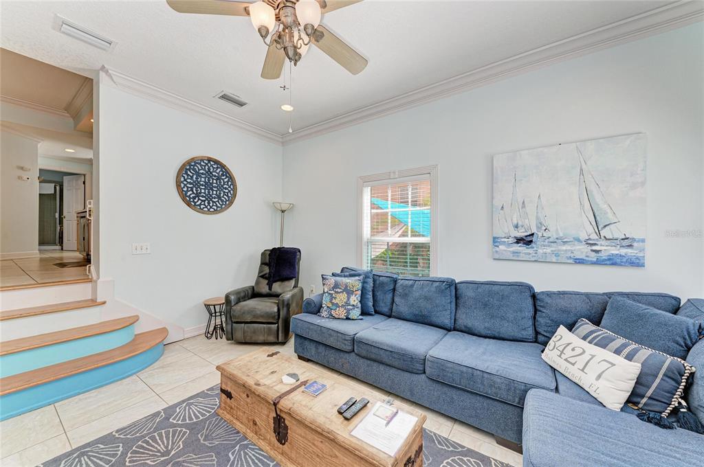 4003 5th Avenue Holmes Beach, FL 34217 - Photo 14 of 56 a living room with furniture and wooden floor