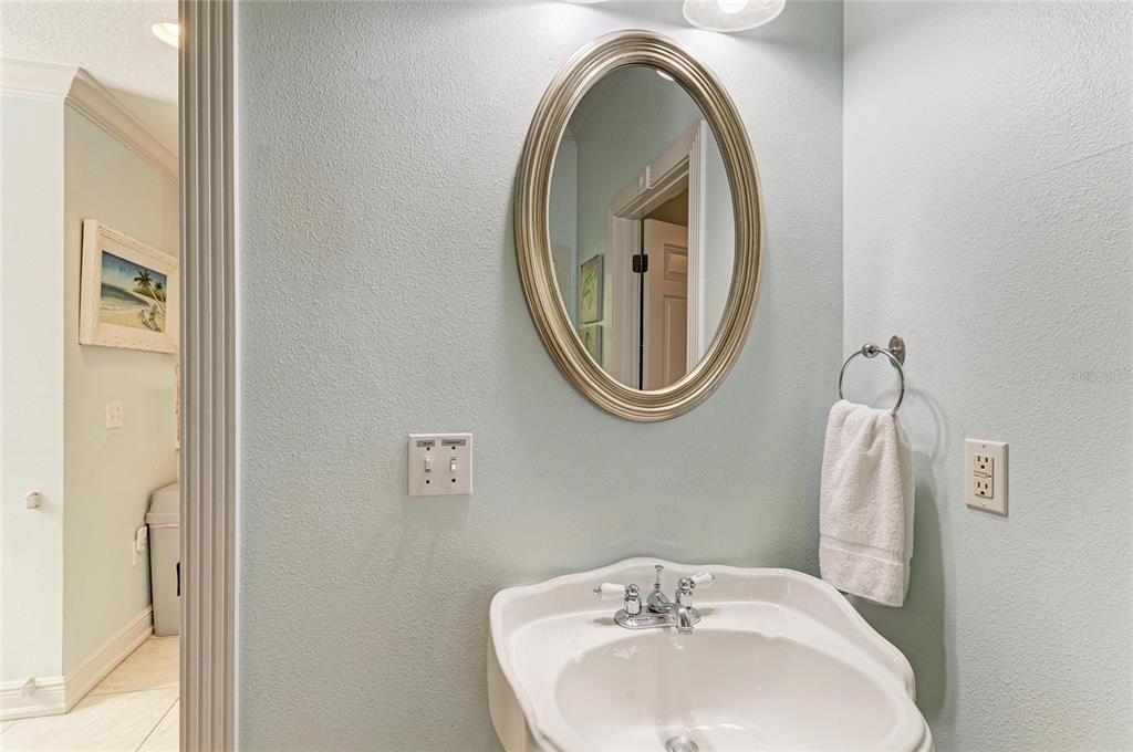 4003 5th Avenue Holmes Beach, FL 34217 - Photo 26 of 56 a bathroom with a sink and a mirror