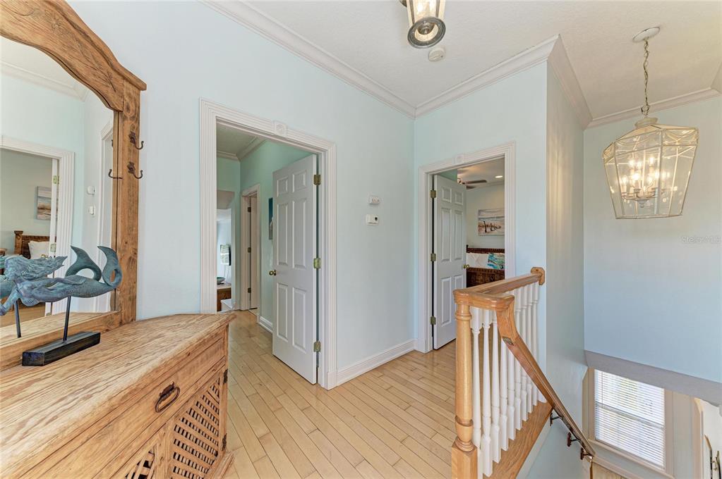 4003 5th Avenue Holmes Beach, FL 34217 - Photo 29 of 56 a view of a room with wooden floor and staircase