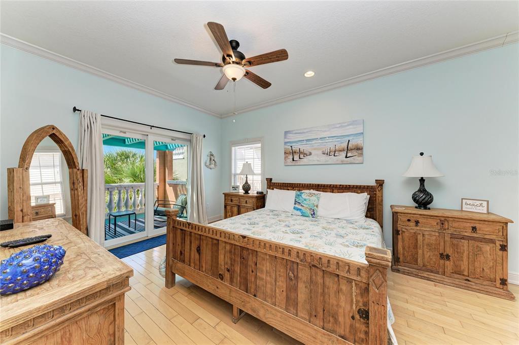 4003 5th Avenue Holmes Beach, FL 34217 - Photo 30 of 56 a bedroom with a bed and a dresser