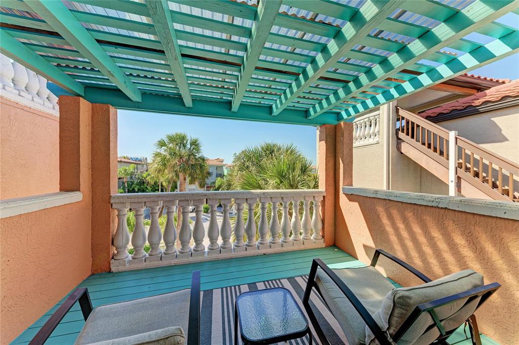 4003 5th Avenue Holmes Beach, FL 34217 - Photo 33 of 56 a view of a chair and table in the balcony