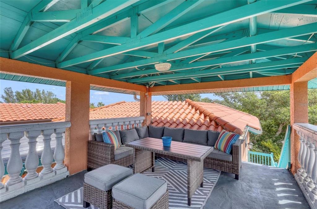 4003 5th Avenue Holmes Beach, FL 34217 - Photo 43 of 56 a outdoor living space with furniture and a garden