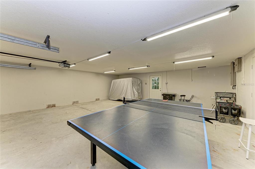 4003 5th Avenue Holmes Beach, FL 34217 - Photo 44 of 56 a room with gym equipment and wooden floor