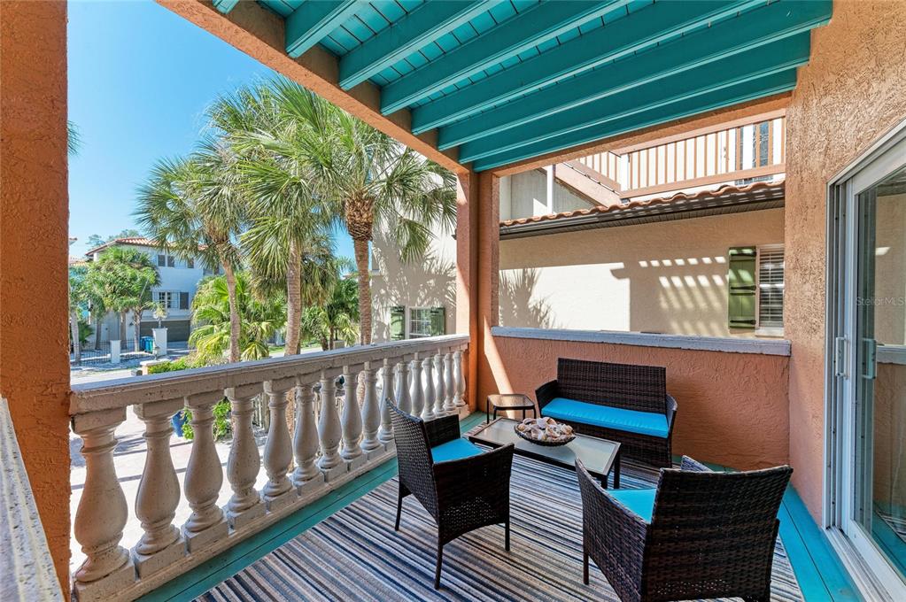4003 5th Avenue Holmes Beach, FL 34217 - Photo 9 of 56 a sitting area with furniture on wooden deck