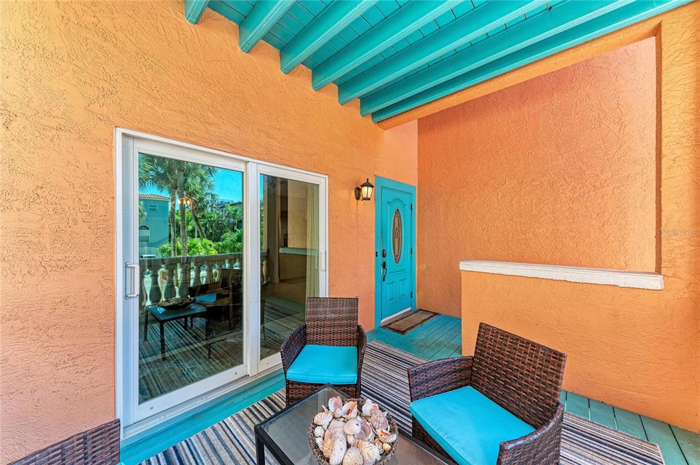 4003 5th Avenue Holmes Beach, FL 34217 - Photo 10 of 56 a outdoor living space with furniture and garden view