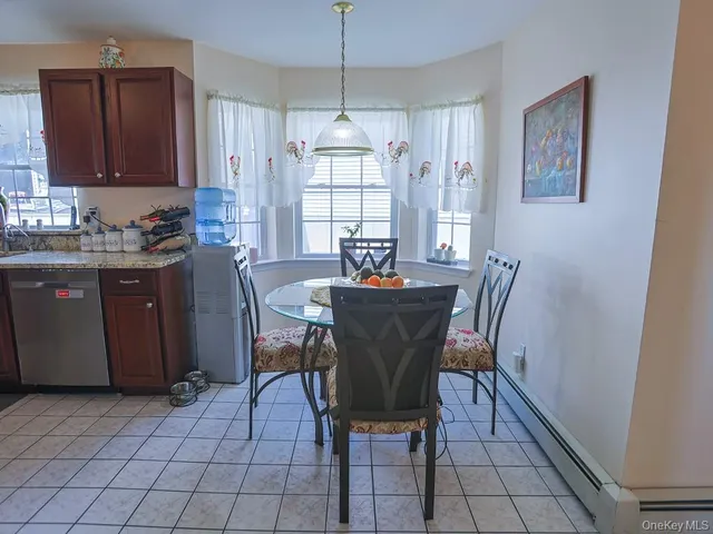 a dining room with furniture and window