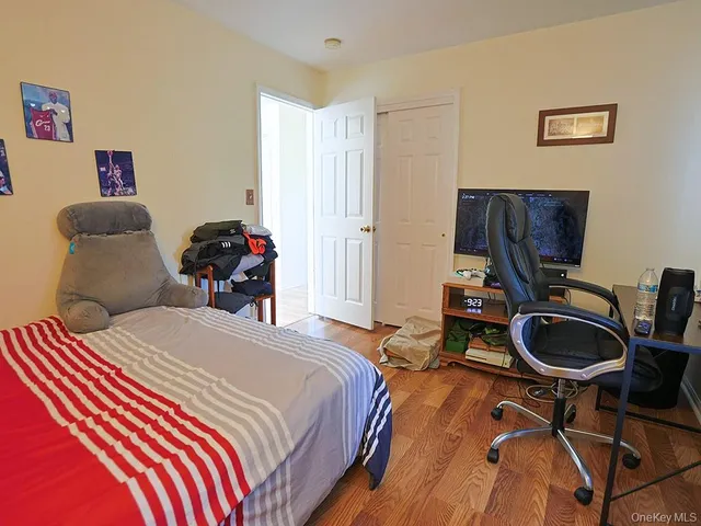 a bedroom with bed and a couch