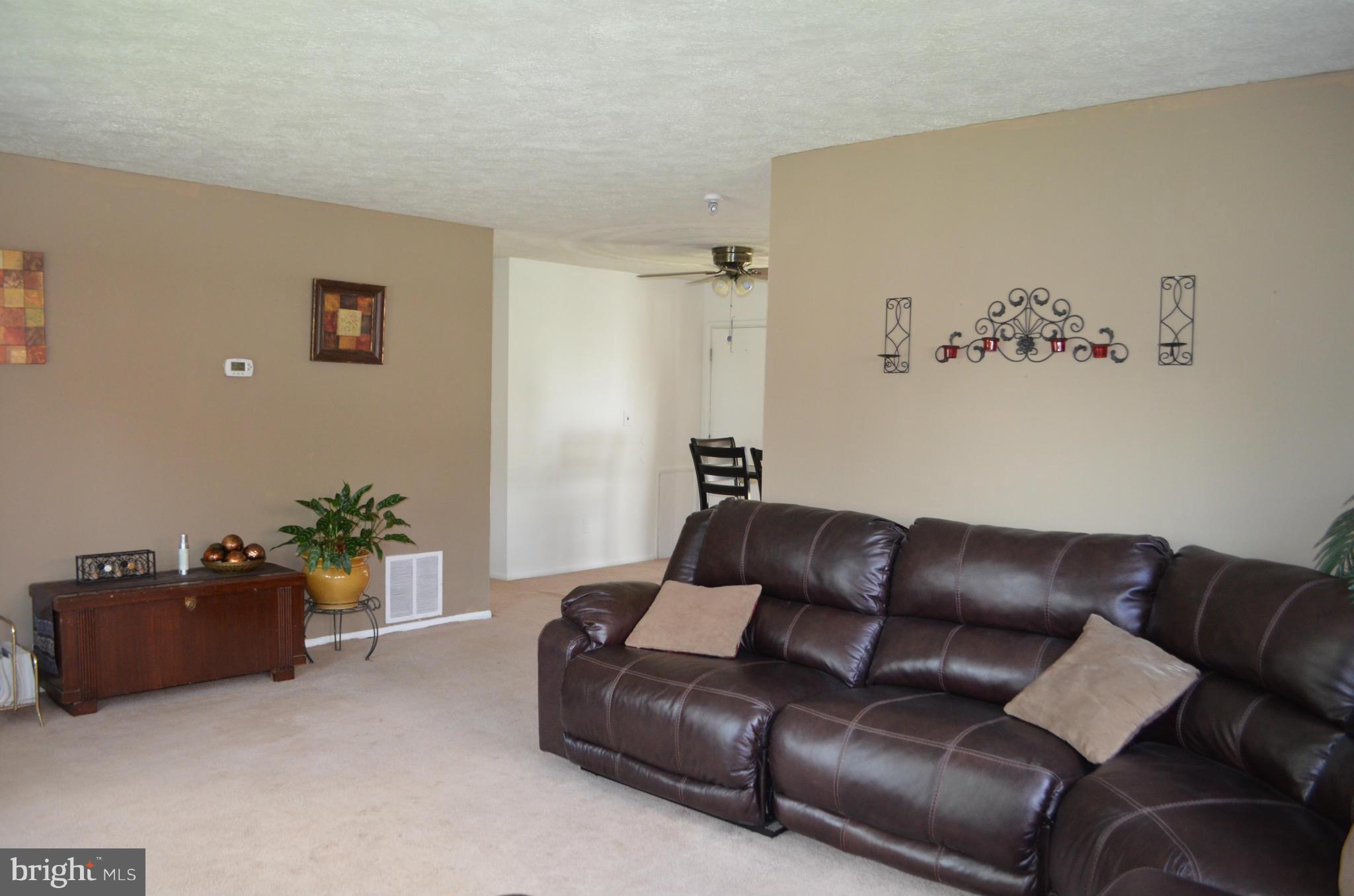 1021 Marksworth Road Baltimore, MD 21228 - Photo 3 of 26 a living room with furniture and a couch