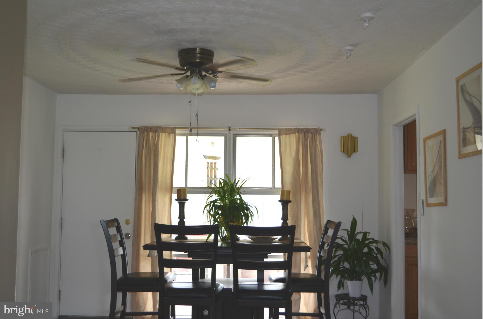 1021 Marksworth Road Baltimore, MD 21228 - Photo 8 of 26 a view of a dining room with furniture and window