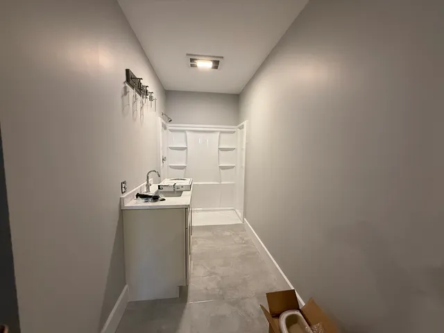 a kitchen with refrigerator and window
