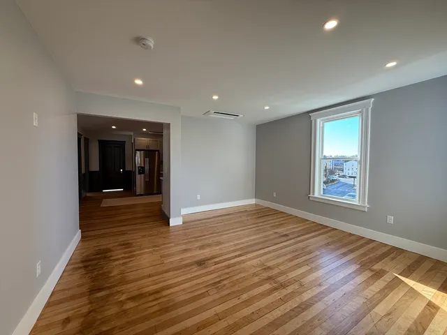 a view of an empty room and glass door