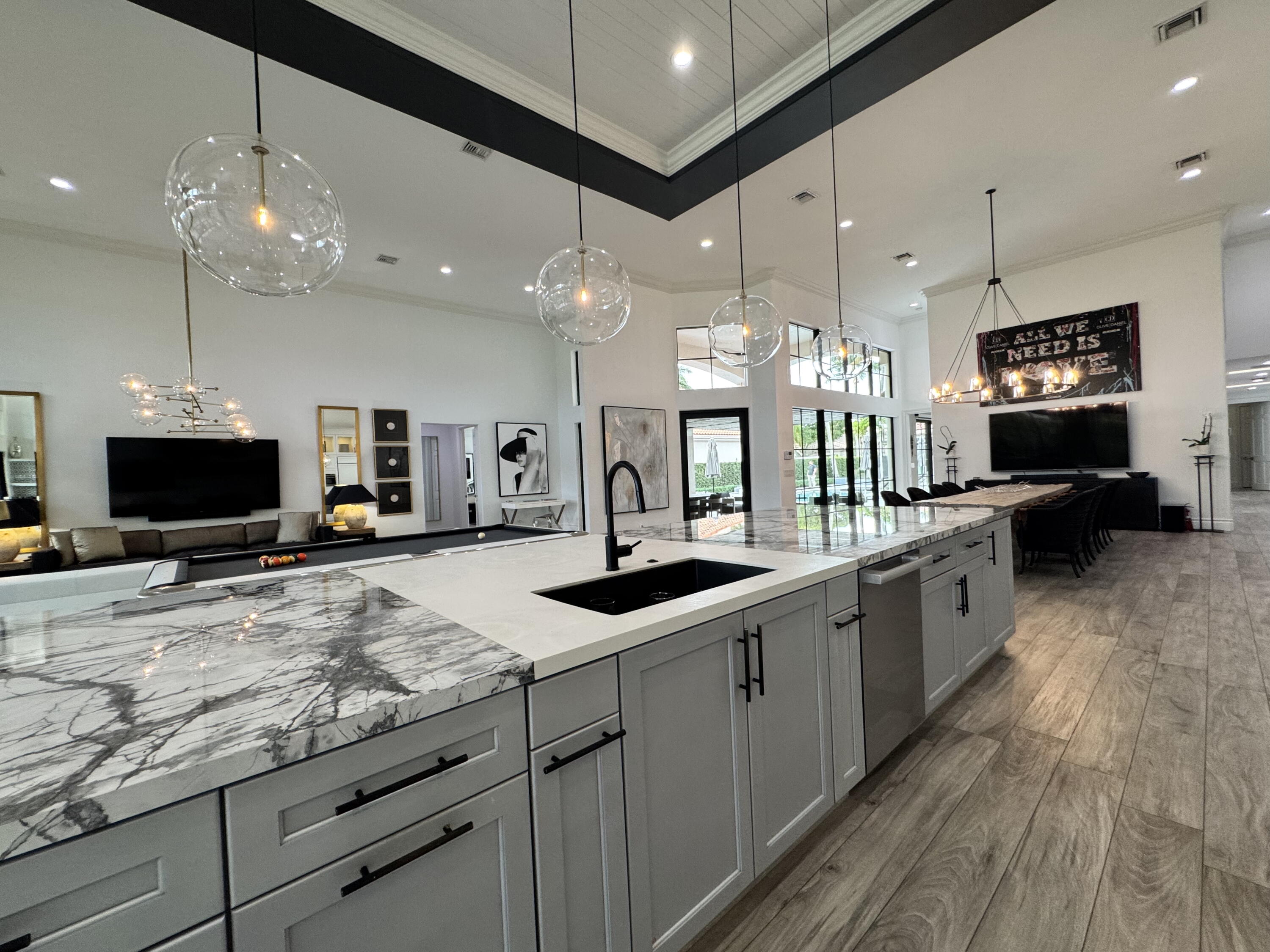 a kitchen with granite countertop a sink and a stove