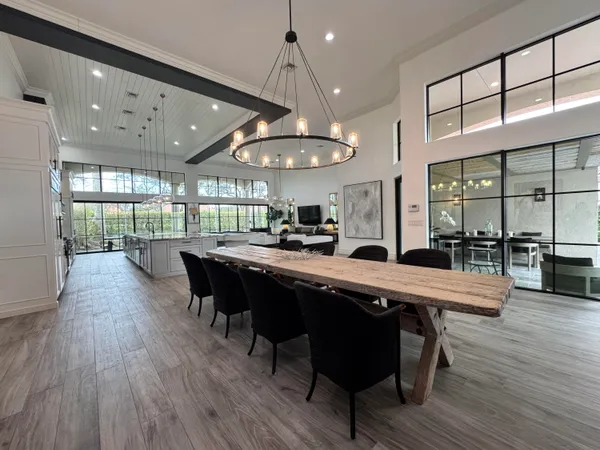 an open kitchen with a table and chairs