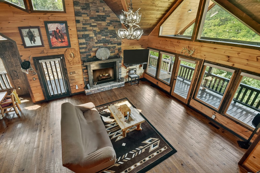 459 Quail Ridge Road Epworth, GA 30541 - Photo 40 of 73 a living room with furniture and a fireplace