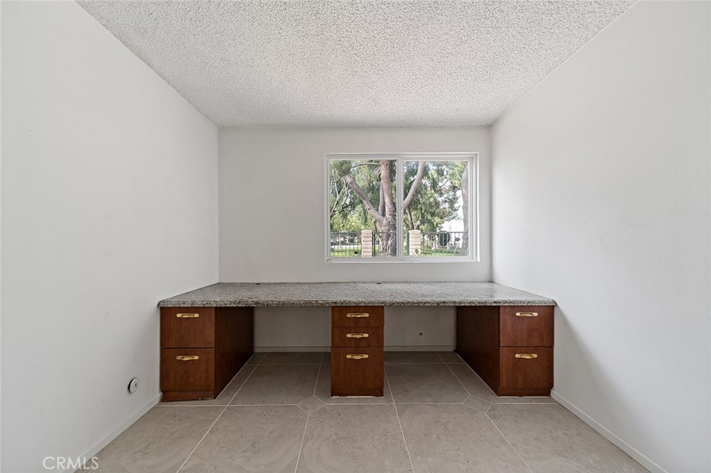 75 Willow Tree Lane Irvine, CA 92612 - Photo 18 of 49 a room with a table and a window