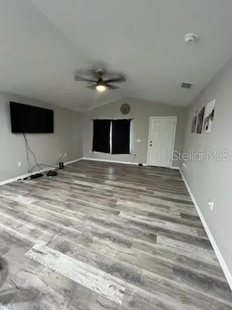 a view of a livingroom with a flat screen tv