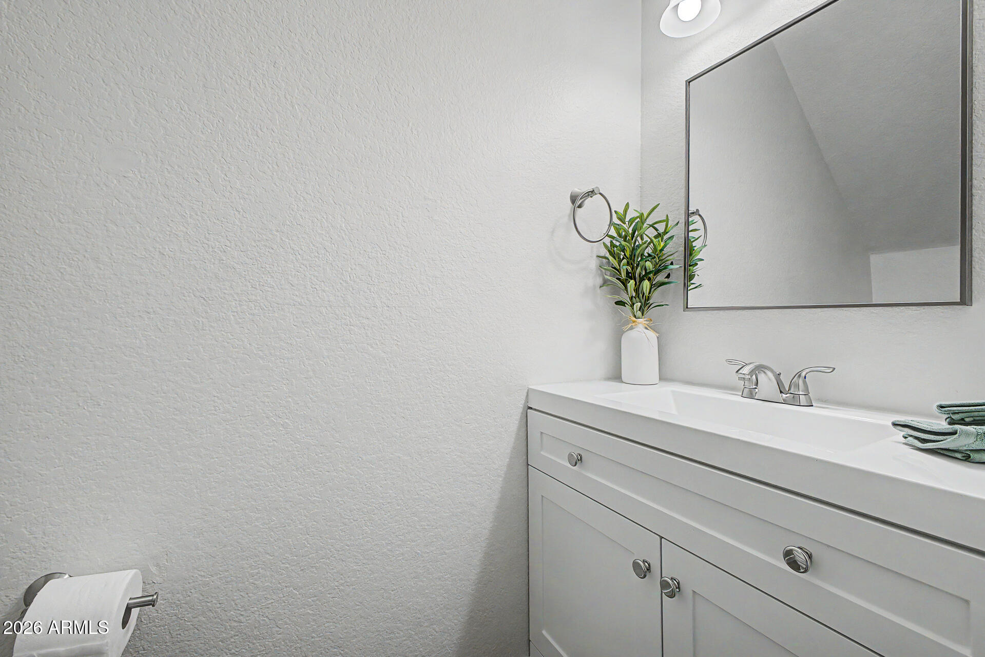 1601 North Saba Street, Unit 301 Chandler, AZ 85225 - Photo 14 of 35 a bathroom with a sink a vanity and a mirror