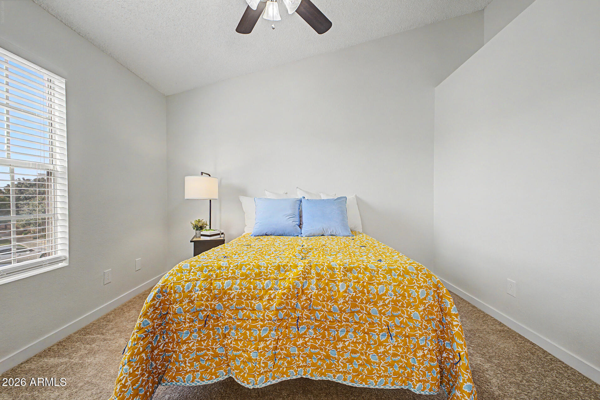 1601 North Saba Street, Unit 301 Chandler, AZ 85225 - Photo 16 of 35 a bed sitting in a bedroom next to a window