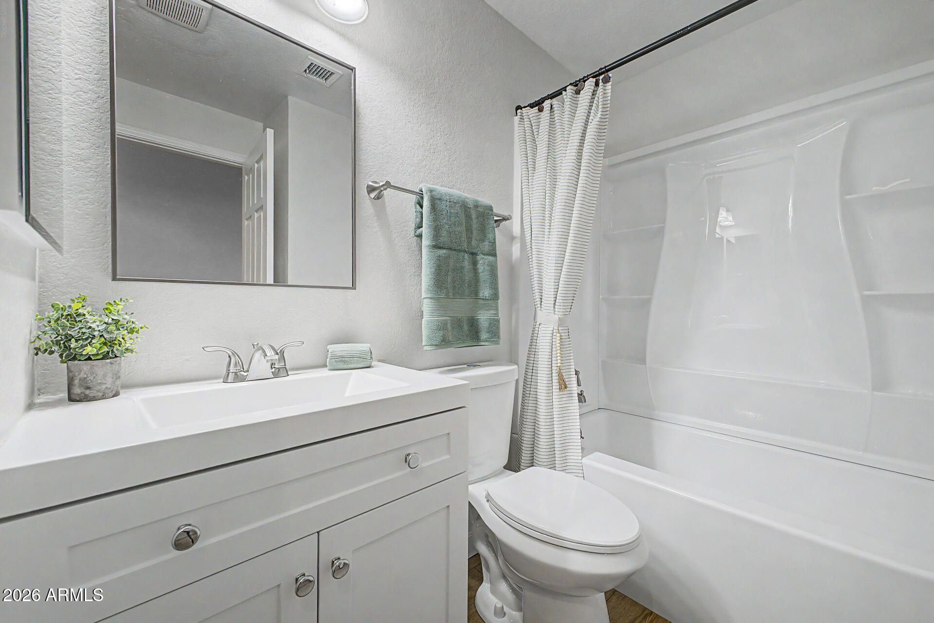 1601 North Saba Street, Unit 301 Chandler, AZ 85225 - Photo 18 of 35 a bathroom with a sink toilet and shower