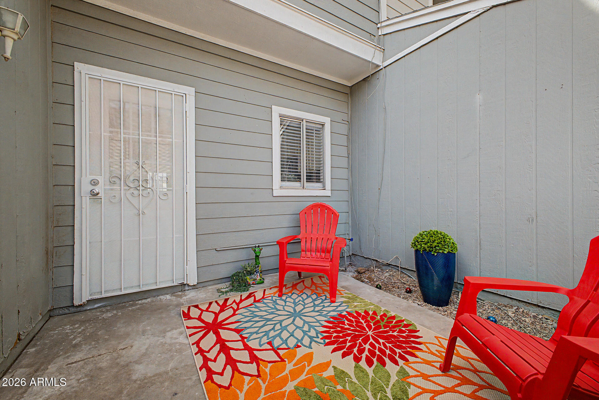 1601 North Saba Street, Unit 301 Chandler, AZ 85225 - Photo 22 of 35 a bedroom with a bed and wooden floor