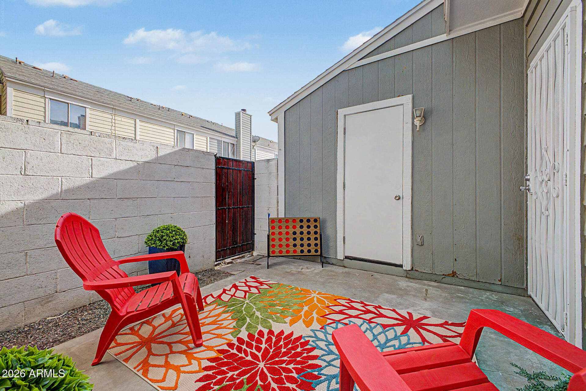 1601 North Saba Street, Unit 301 Chandler, AZ 85225 - Photo 23 of 35 a balcony with table and chairs