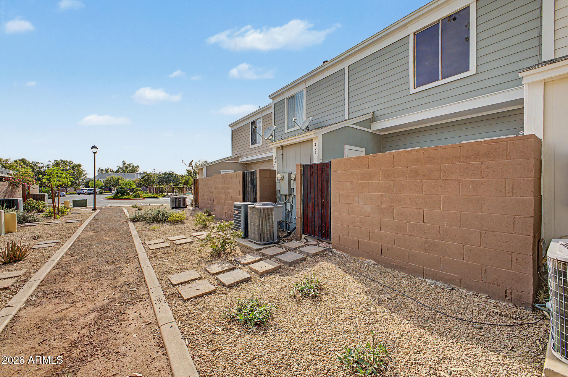 1601 North Saba Street, Unit 301 Chandler, AZ 85225 - Photo 26 of 35 a view of a back yard of the house
