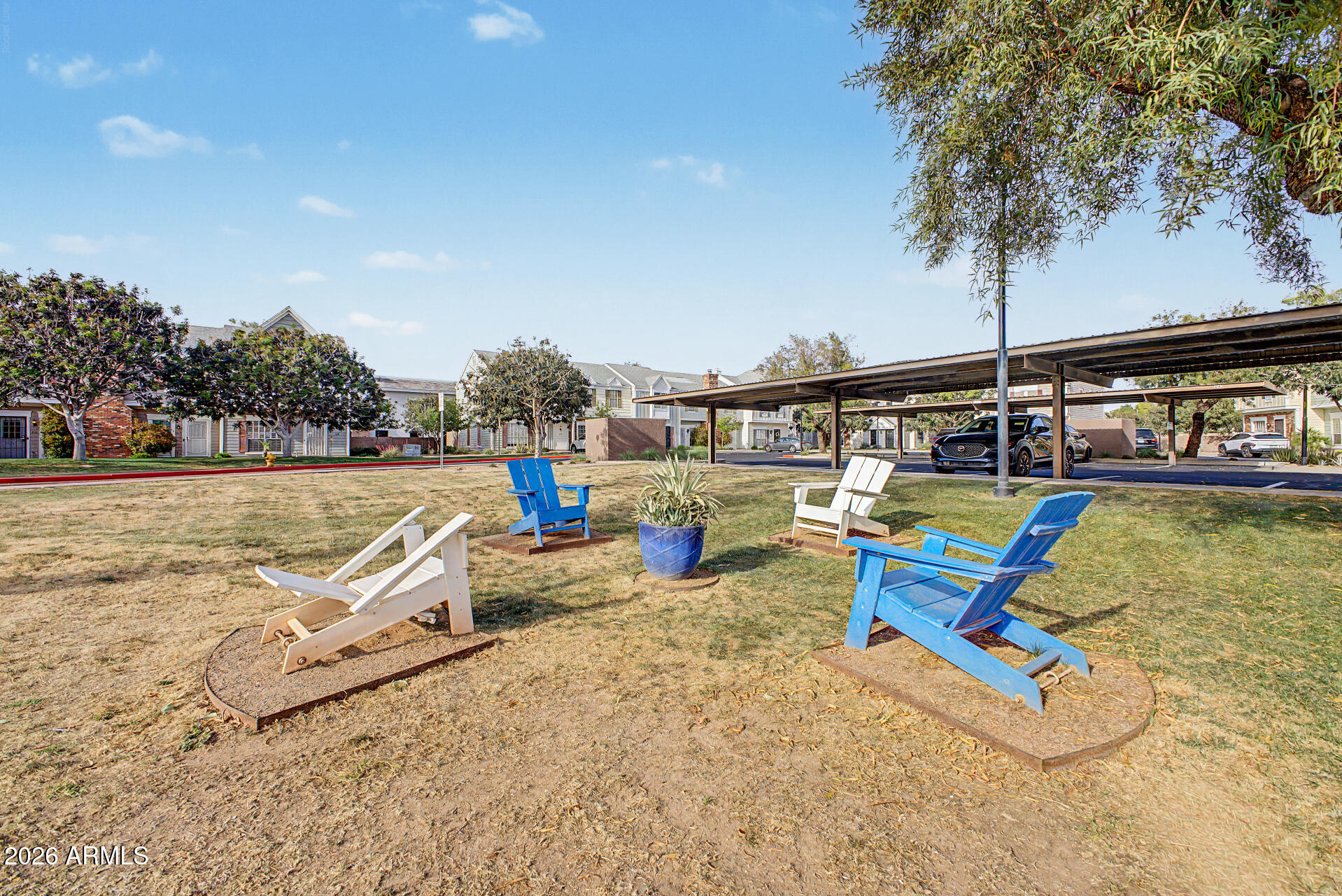 1601 North Saba Street, Unit 301 Chandler, AZ 85225 - Photo 32 of 35 a view of a swimming pool with a lounge chair