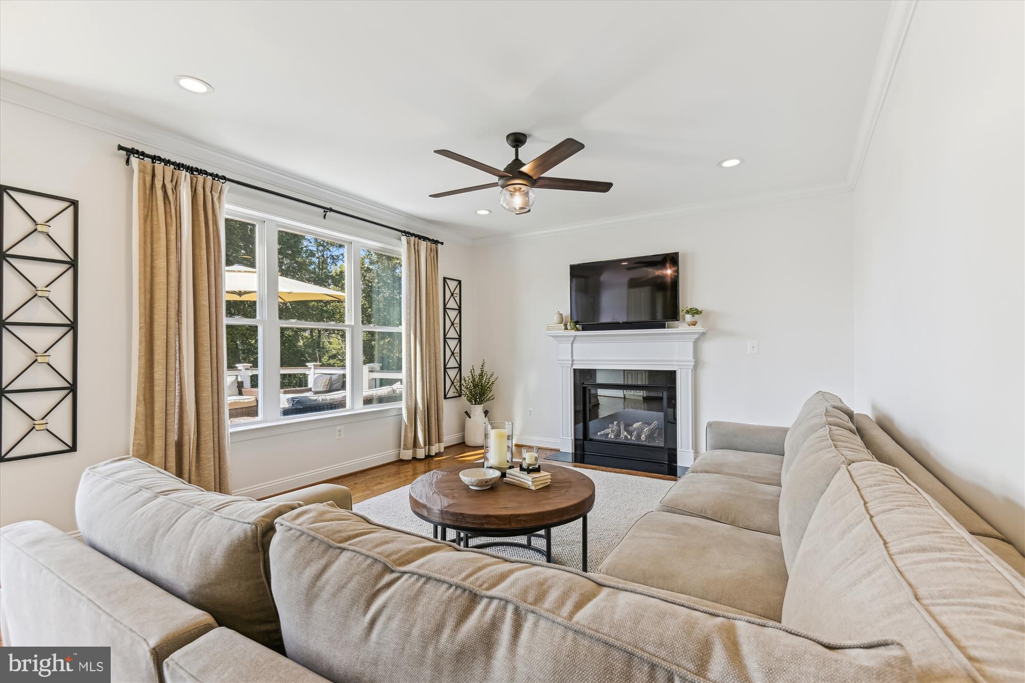 12700 Handboard Road Union Bridge, MD 21791 - Photo 22 of 74 a living room with furniture a fireplace and a large window