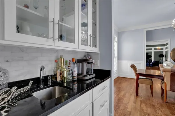 a kitchen with a sink and cabinets