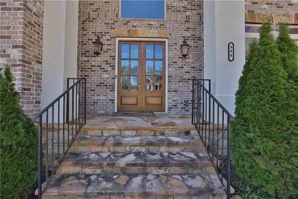 an entrance view of a house with stairs