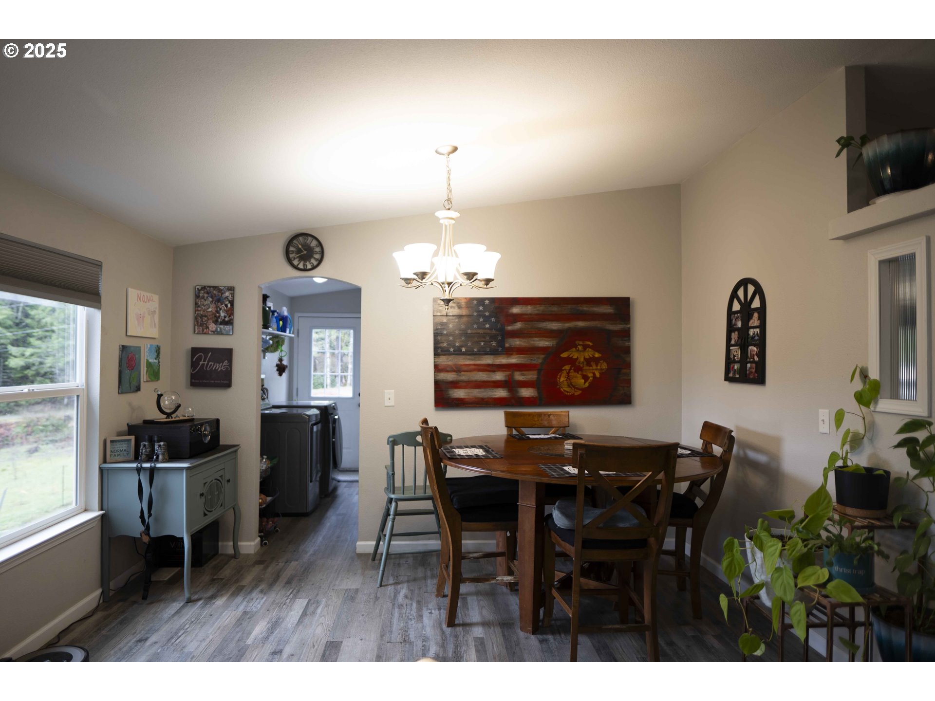 6228 Upper Cow Creek Road Azalea, OR 97410 - Photo 14 of 47 a view of a dining room with furniture and chandelier