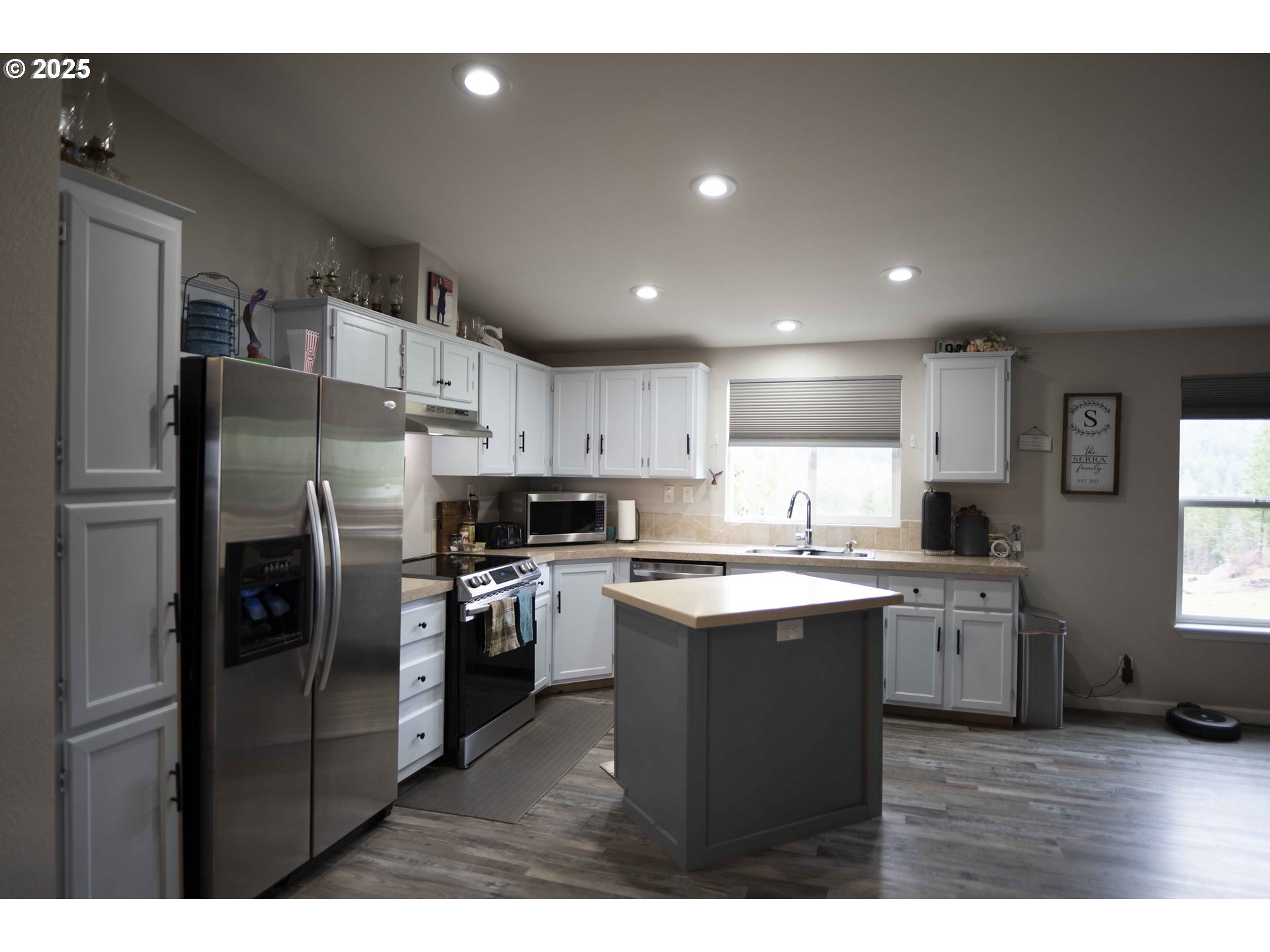 6228 Upper Cow Creek Road Azalea, OR 97410 - Photo 16 of 47 a kitchen with cabinets and stainless steel appliances