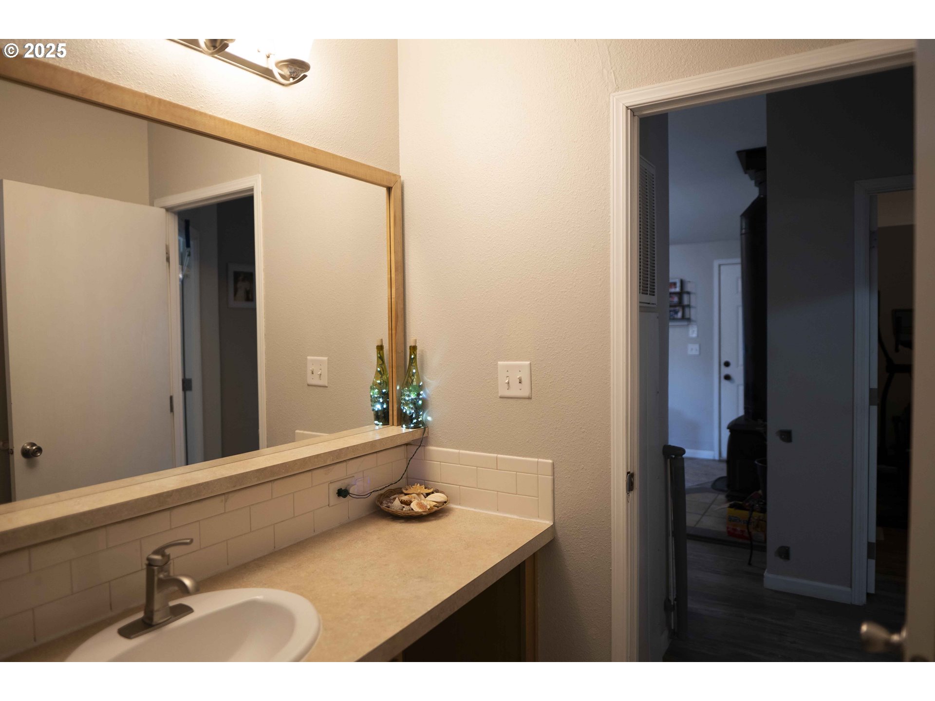 6228 Upper Cow Creek Road Azalea, OR 97410 - Photo 23 of 47 a bathroom with a sink and a mirror