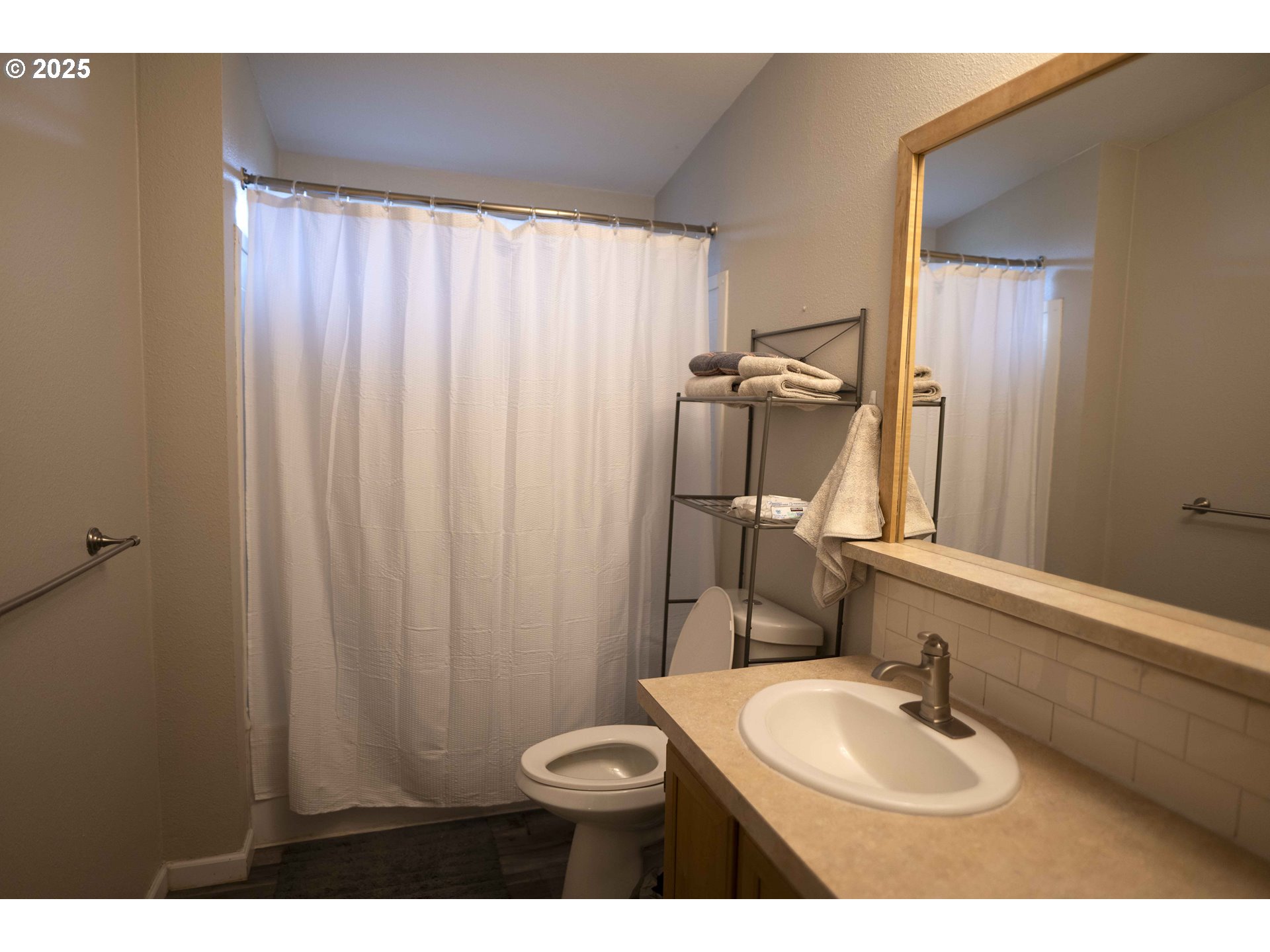 6228 Upper Cow Creek Road Azalea, OR 97410 - Photo 26 of 47 a bathroom with a sink a toilet and mirror
