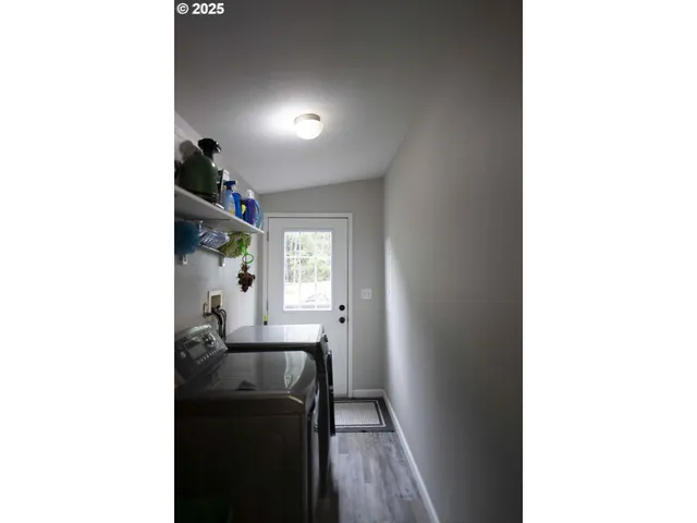 a view of a wooden house with a yard