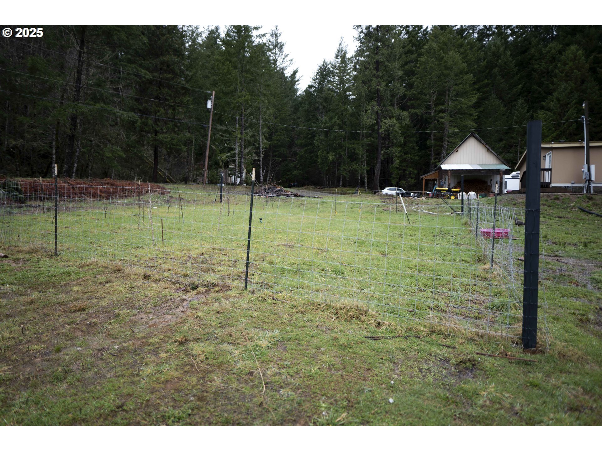 6228 Upper Cow Creek Road Azalea, OR 97410 - Photo 43 of 47 a backyard of a house with lots of green space