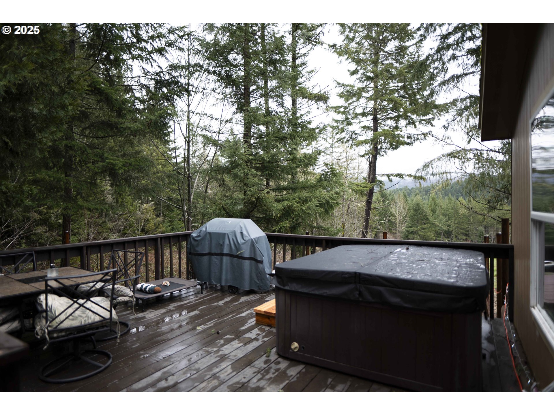 6228 Upper Cow Creek Road Azalea, OR 97410 - Photo 7 of 47 a view of a couches and a table in the balcony