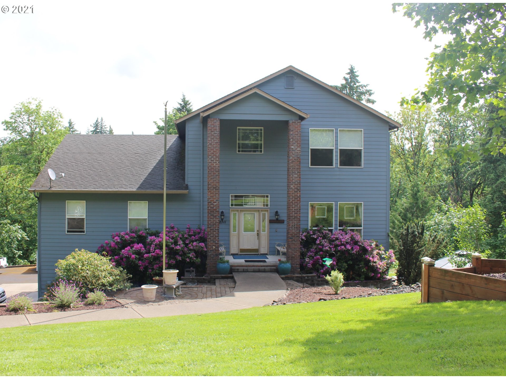 22711 Northwest 67th Avenue Ridgefield, WA 98642 - Photo 1 of 19 a front view of house with yard and outdoor seating