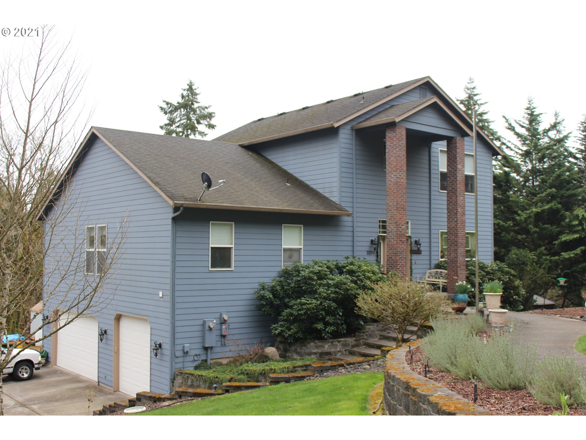 22711 Northwest 67th Avenue Ridgefield, WA 98642 - Photo 2 of 19 a front view of a house with a yard