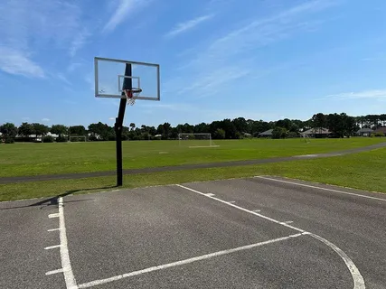 a view of a park with sitting area