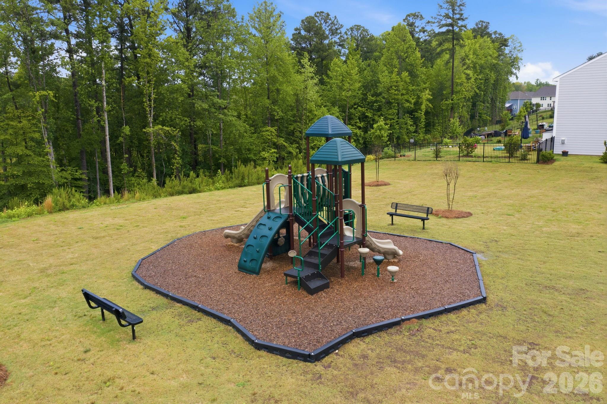 234 Hamptons Cove Road Troutman, NC 28166 - Photo 28 of 32 a view of a swimming pool with a yard