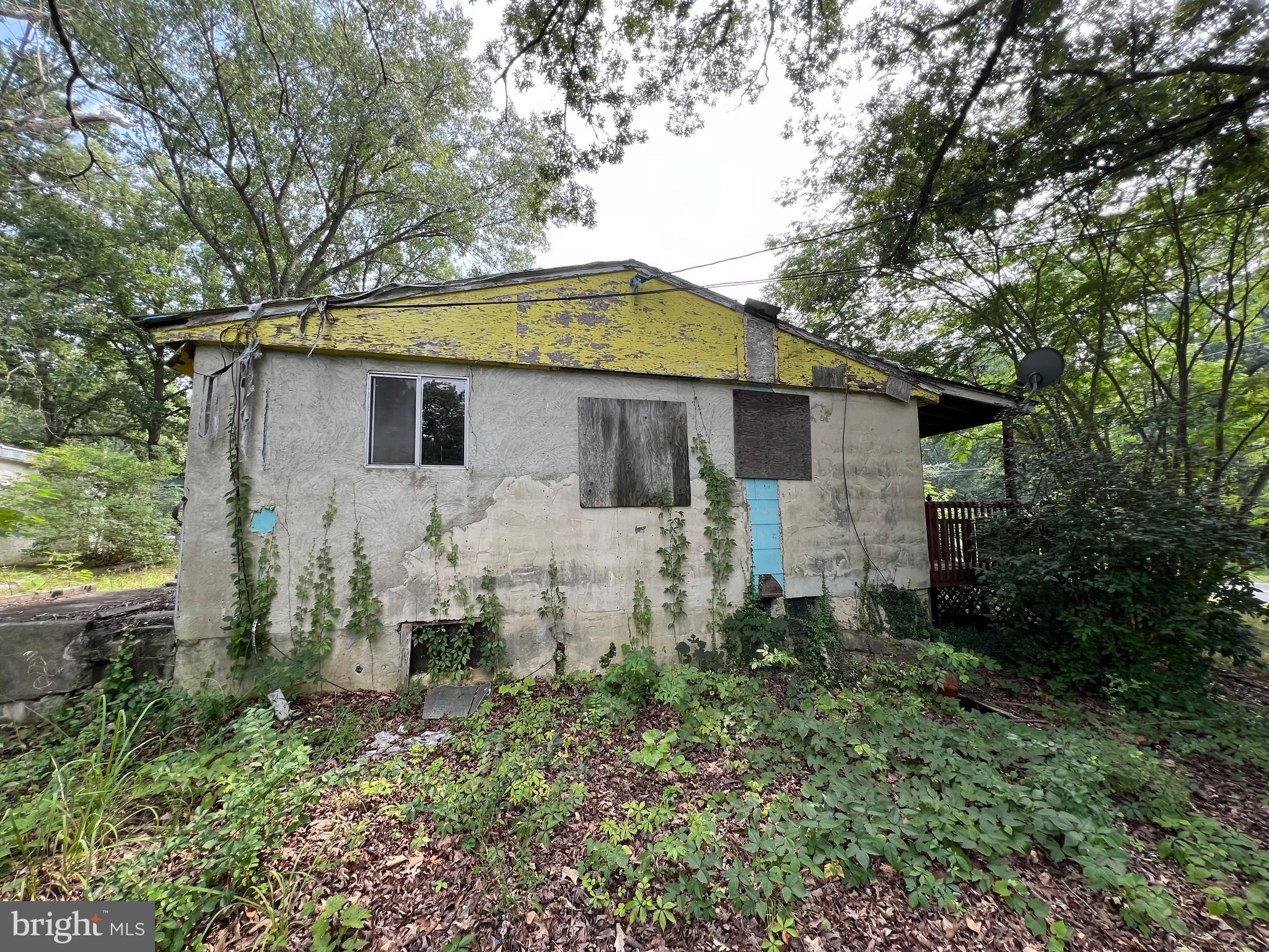 174 New Brooklyn Road Berlin, NJ 08009 - Photo 2 of 34 a front view of house with yard and trees in the background