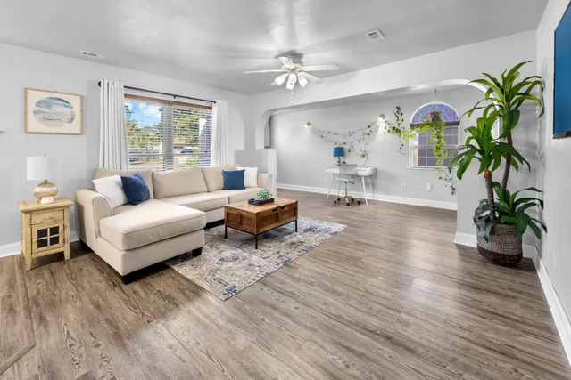 wooden floor in an empty room with a window