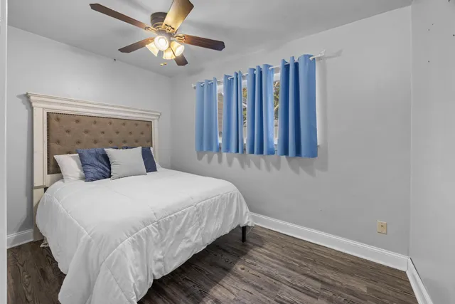 a bathroom with a toilet a sink and a window