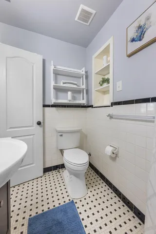 a view of a balcony with wooden floor and stairs
