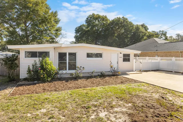 a kitchen with a sink a counter top space and appliances