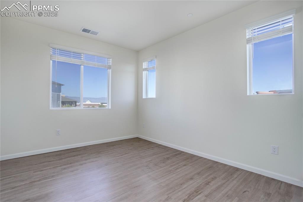 3865 Presidio Point, Unit 101 Colorado Springs, CO 80920 - Photo 9 of 20 an empty room with a window