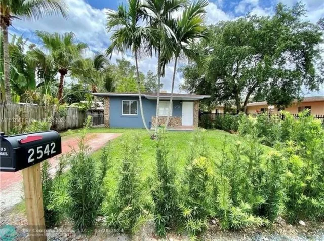 a front view of house with small garden