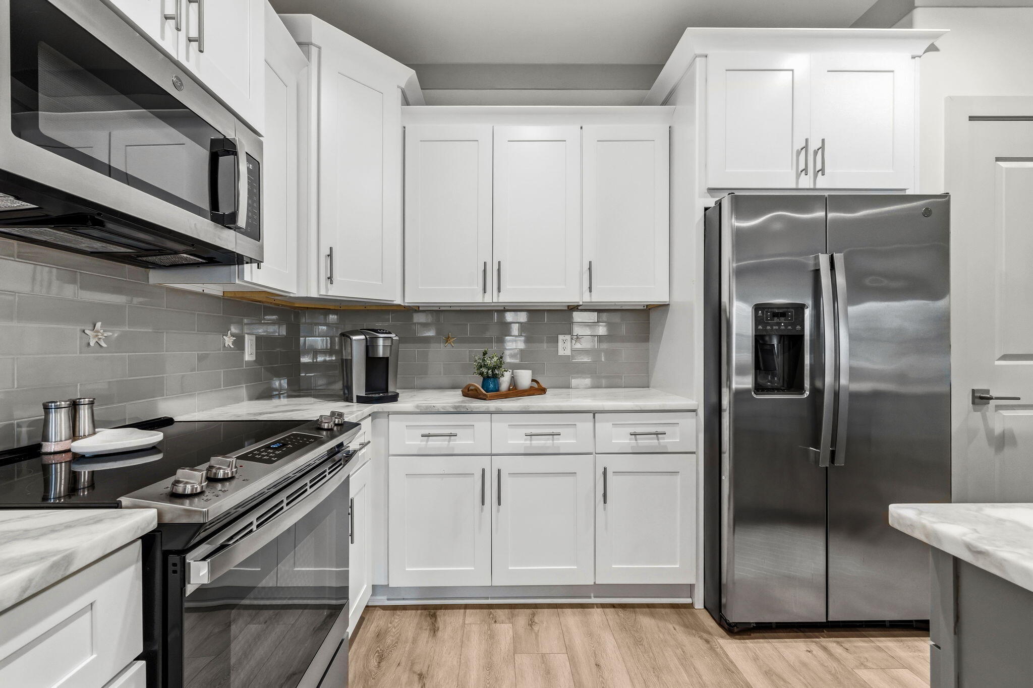 45 Golden Bell Court, Unit 45C Inlet Beach, FL 32461 - Photo 12 of 43 a kitchen with stainless steel appliances granite countertop a refrigerator sink and cabinets