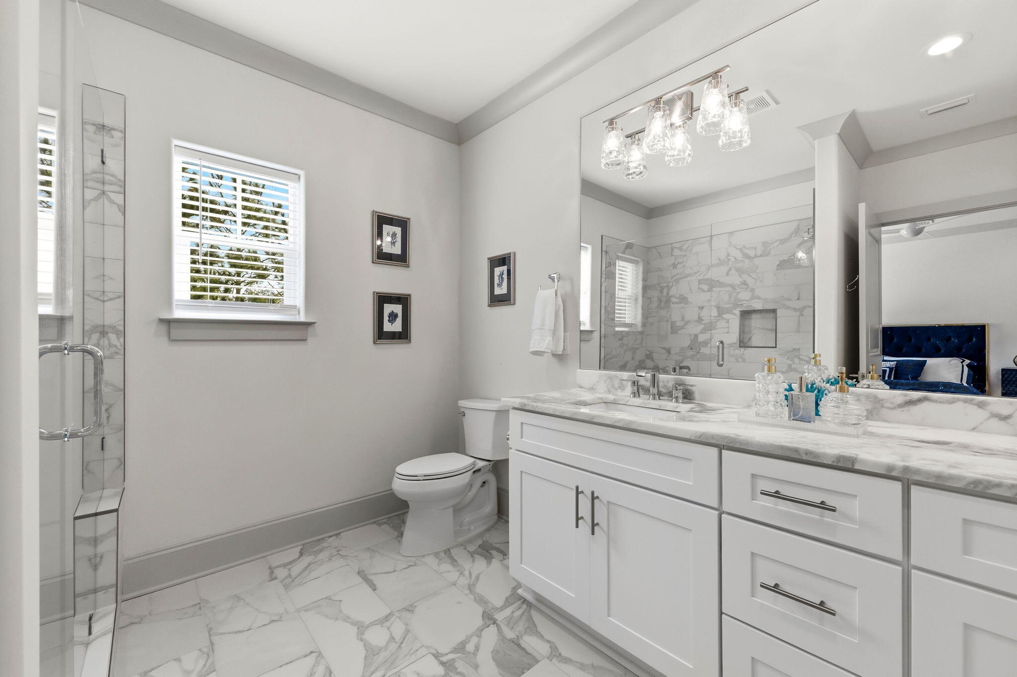 45 Golden Bell Court, Unit 45C Inlet Beach, FL 32461 - Photo 22 of 43 a spacious bathroom with a granite countertop sink a toilet and a mirror